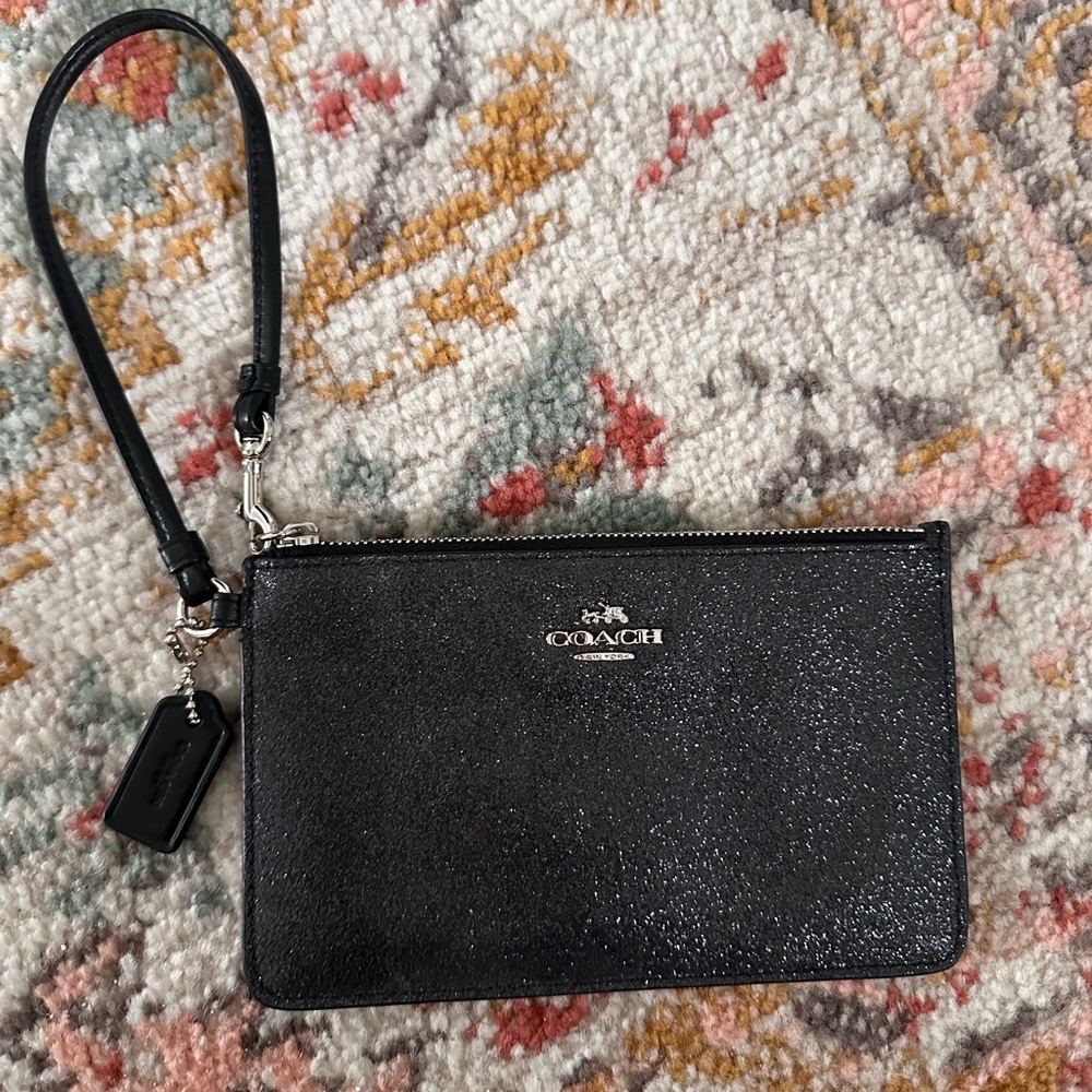 Black sparkle Coach wristlet.